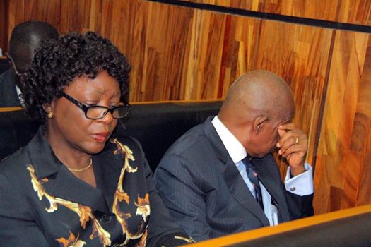 Justice Adeniyi Ademola and wife...hiding the face from poking cameras